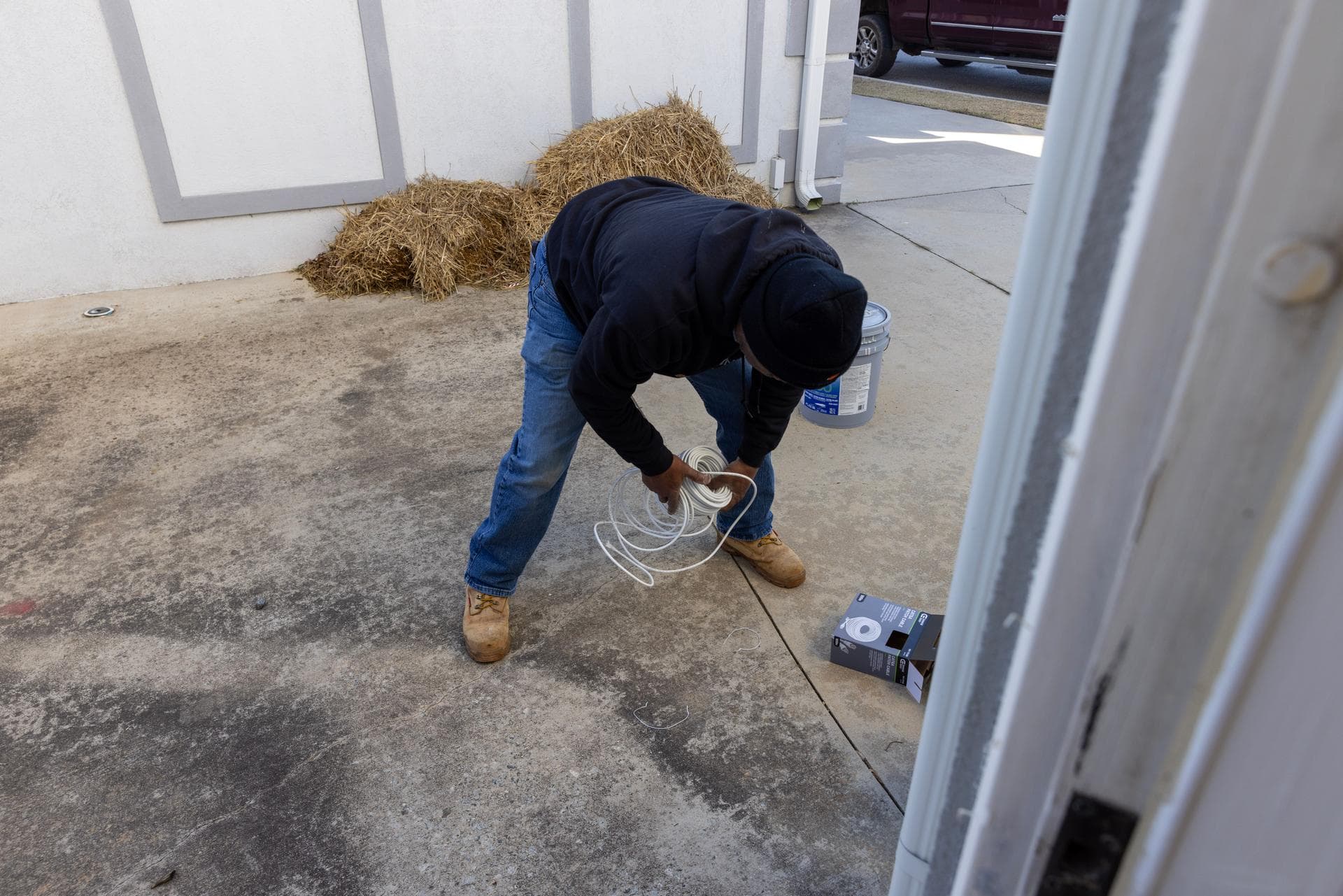 Norvet MSP technician pulling cable at building entry point