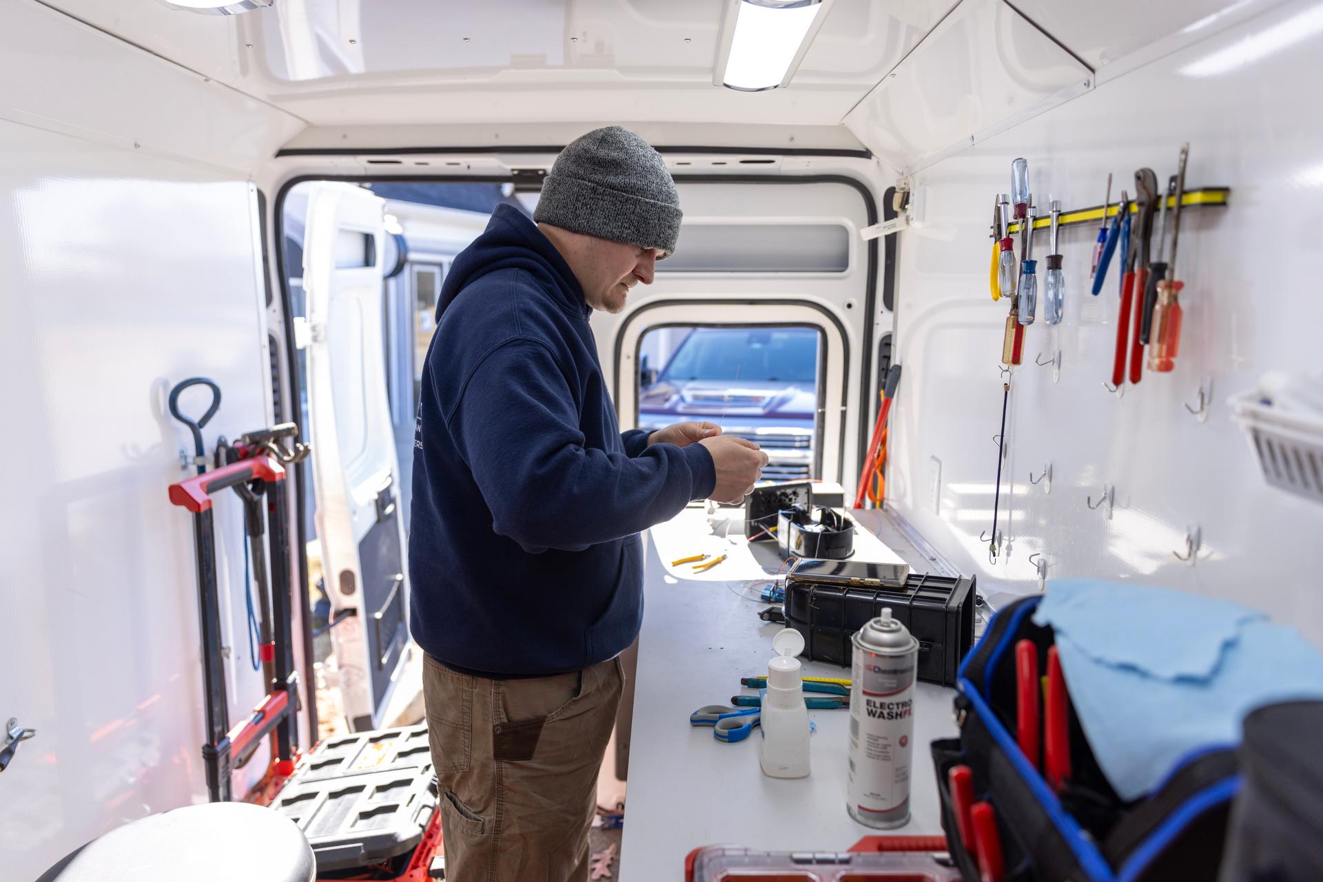 Norvet MSP technician installing fiber at client premises